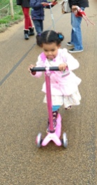 3-yo determination on the Mini Micro in Popping Pink with sequined scooter sleeve and a bell!